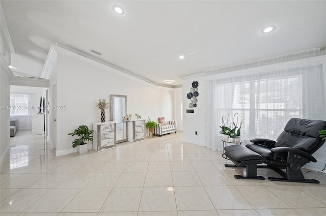 living area with light tile patterned floors and crown molding