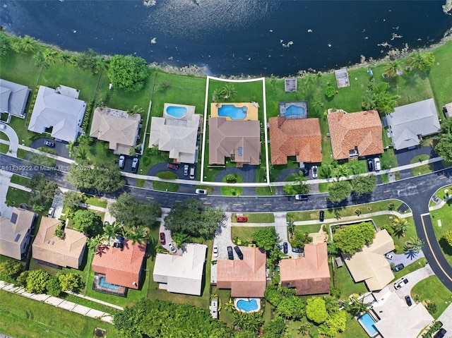 birds eye view of property featuring a water view