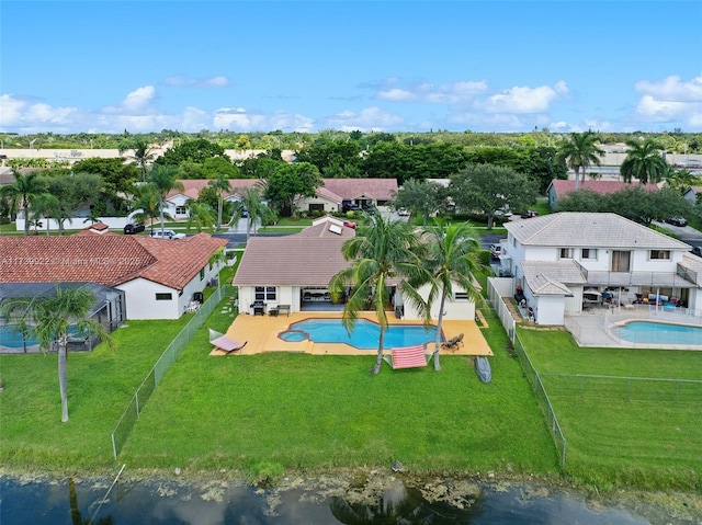 birds eye view of property with a water view