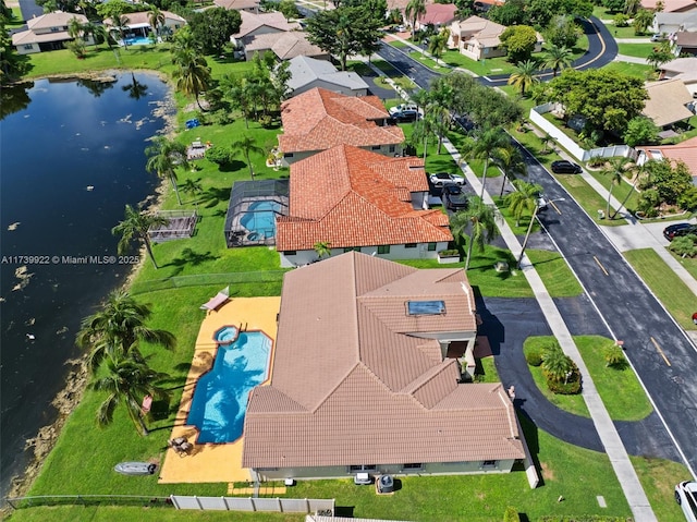 drone / aerial view with a water view