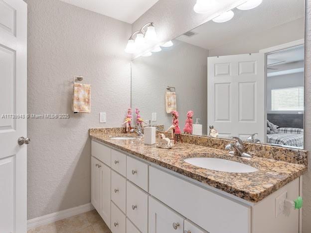 bathroom featuring vanity and tile patterned flooring