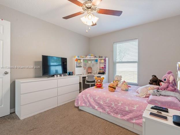 bedroom featuring carpet and ceiling fan