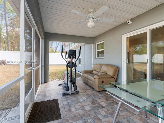 exercise area with ceiling fan