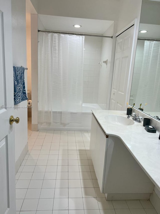 bathroom with vanity, tile patterned flooring, and shower / bath combination with curtain