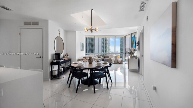 851 NE 1st Ave Unit 3303, Miami, FL 33132 - tiled dining space featuring a chandelier and a wall of windows