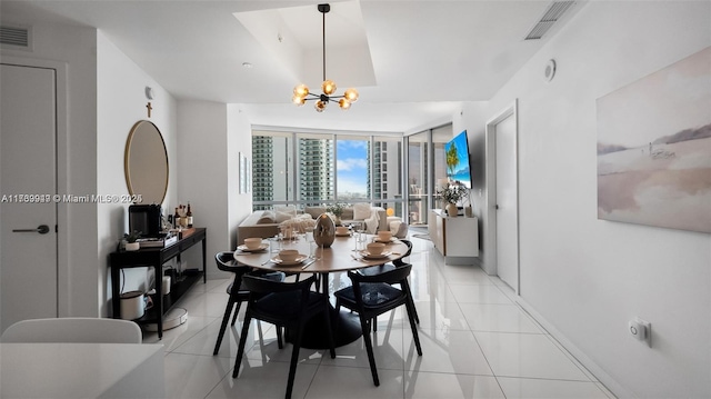 851 NE 1st Ave Unit 3303, Miami, FL 33132 - tiled dining space featuring expansive windows and an inviting chandelier