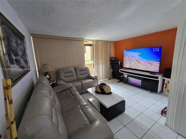 living room with light tile patterned floors and a textured ceiling