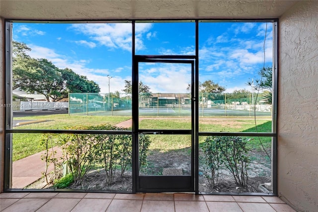 unfurnished sunroom featuring plenty of natural light