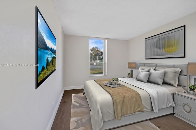 bedroom with hardwood / wood-style floors