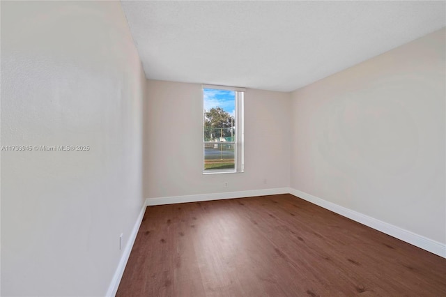 empty room featuring wood-type flooring