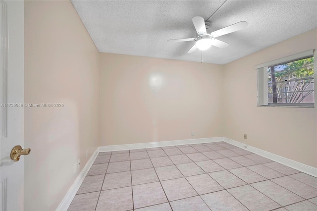 spare room with ceiling fan and a textured ceiling