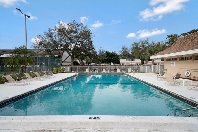 view of pool featuring a patio