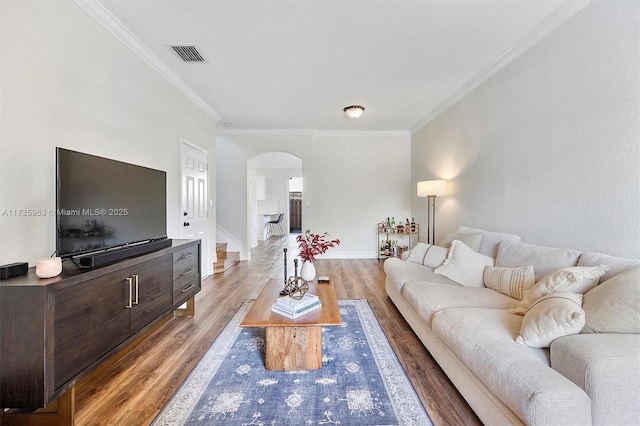 living room featuring ornamental molding and hardwood / wood-style floors