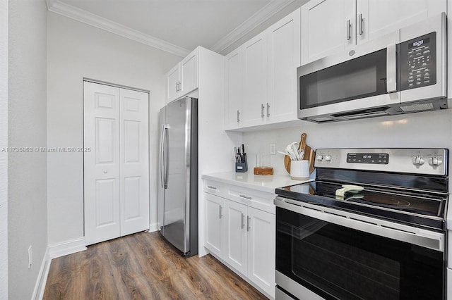 kitchen featuring white cabinetry, appliances with stainless steel finishes, crown molding, and dark hardwood / wood-style flooring