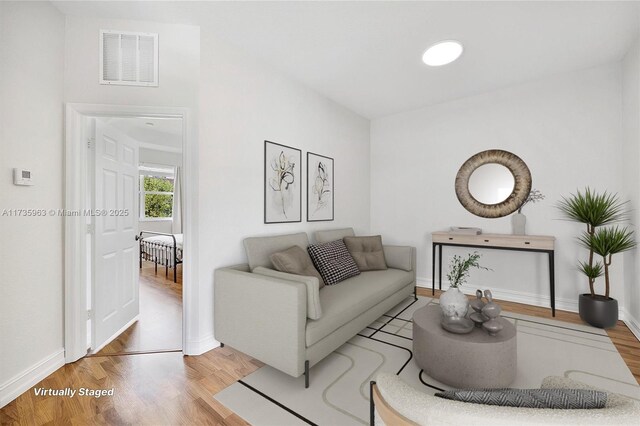 living room with light hardwood / wood-style flooring