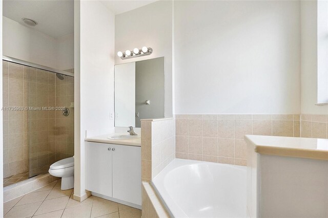 full bathroom featuring tile patterned floors, vanity, toilet, and separate shower and tub