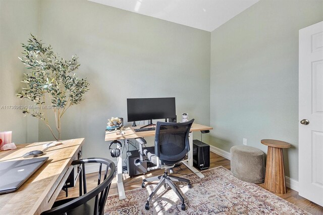 office area with hardwood / wood-style floors