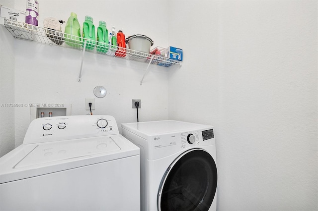 laundry room with independent washer and dryer