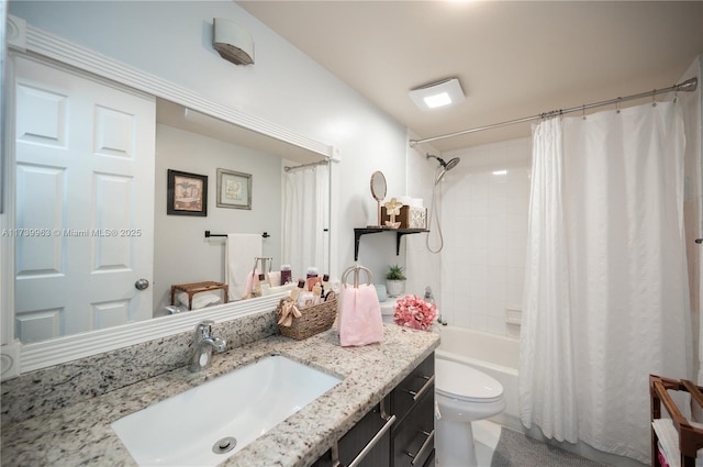 full bathroom featuring vanity, toilet, and shower / tub combo with curtain