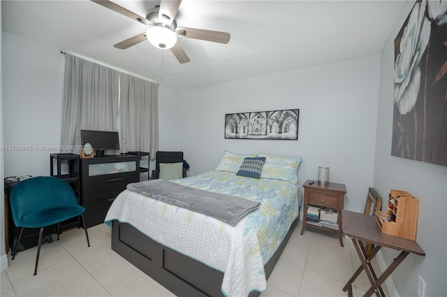 bedroom with ceiling fan and light tile patterned floors