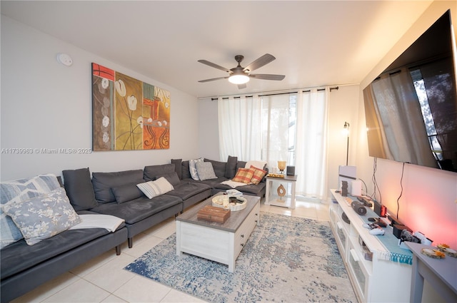 tiled living room with ceiling fan