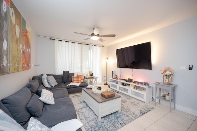 living room featuring light tile patterned floors and ceiling fan