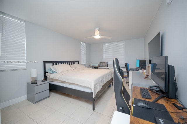 tiled bedroom with ceiling fan