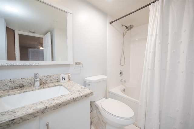 full bathroom with vanity, shower / bath combination with curtain, and toilet