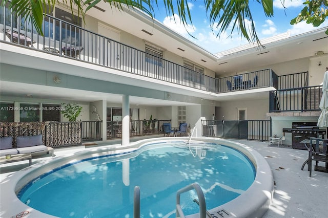 view of pool with grilling area