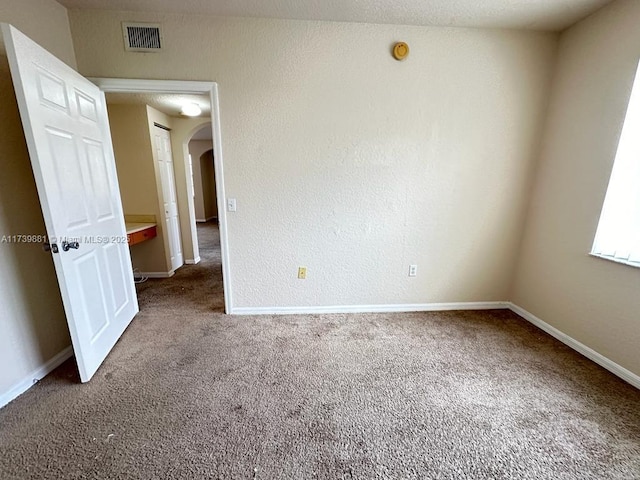 empty room featuring carpet flooring