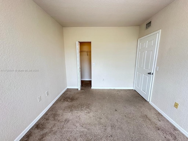 unfurnished room with carpet floors