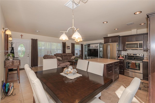 dining area with light tile patterned floors