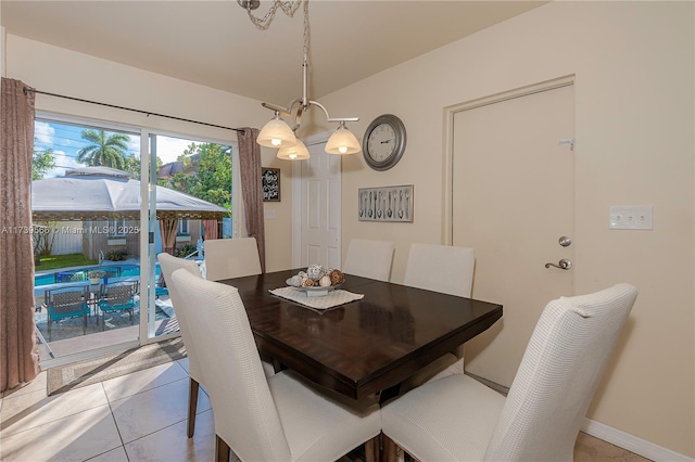 dining space featuring light tile patterned floors