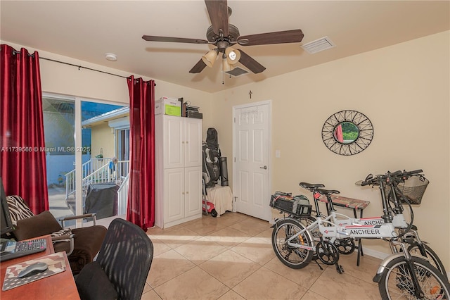 interior space with ceiling fan