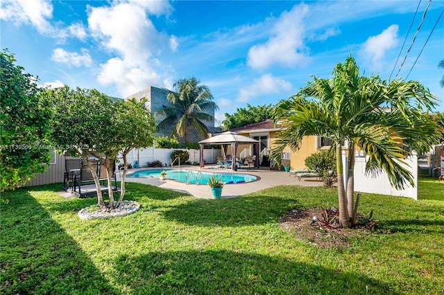 view of swimming pool with a gazebo, a yard, and a patio area