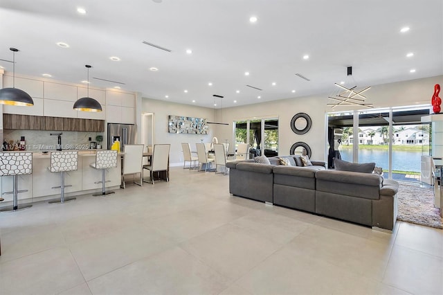 living room featuring a water view