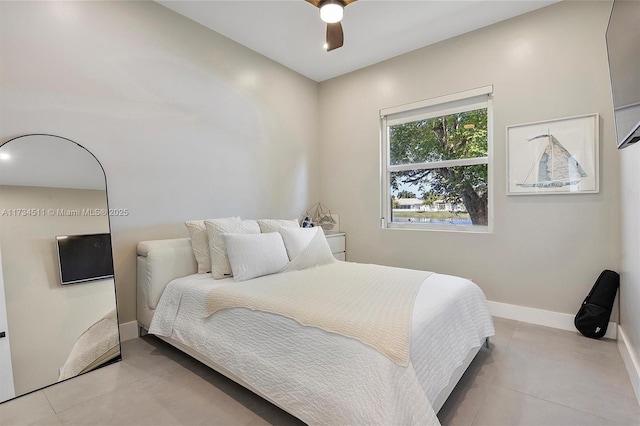 bedroom with light tile patterned floors and ceiling fan