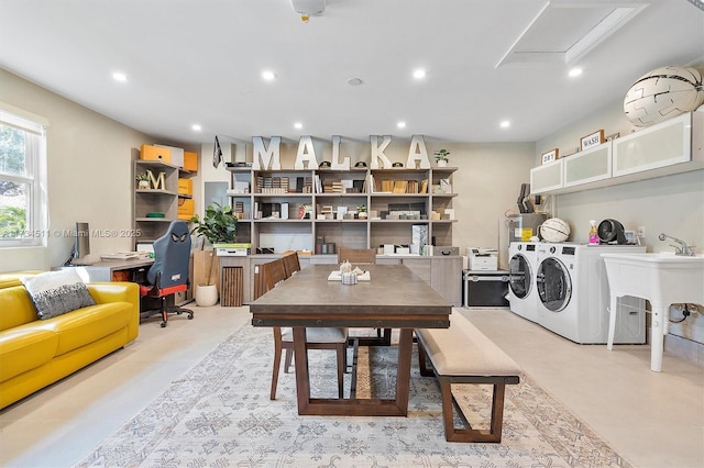 dining area featuring sink and washer and dryer