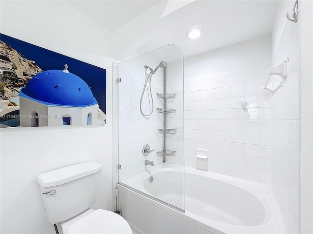 bathroom featuring bath / shower combo with glass door and toilet