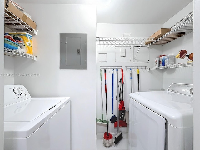 laundry area with separate washer and dryer and electric panel