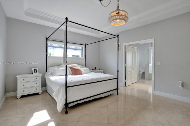 bedroom with crown molding, a tray ceiling, and light tile patterned floors