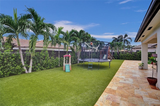 view of yard with a trampoline