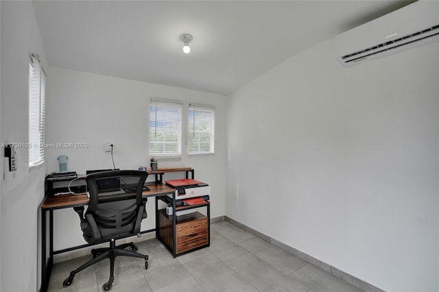 office featuring light tile patterned flooring and a wall mounted air conditioner