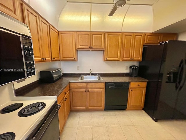 kitchen with sink, light tile patterned floors, black appliances, and ceiling fan