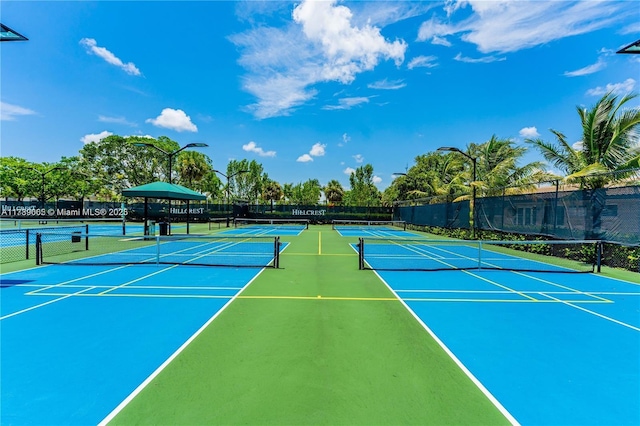 view of sport court featuring a gazebo and basketball hoop