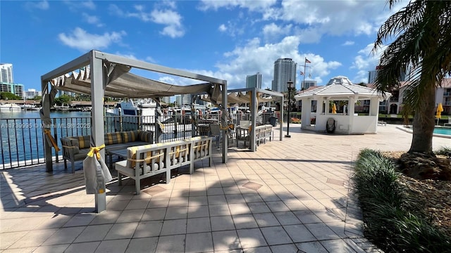 surrounding community with a gazebo and a water view