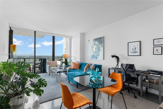 living room featuring floor to ceiling windows