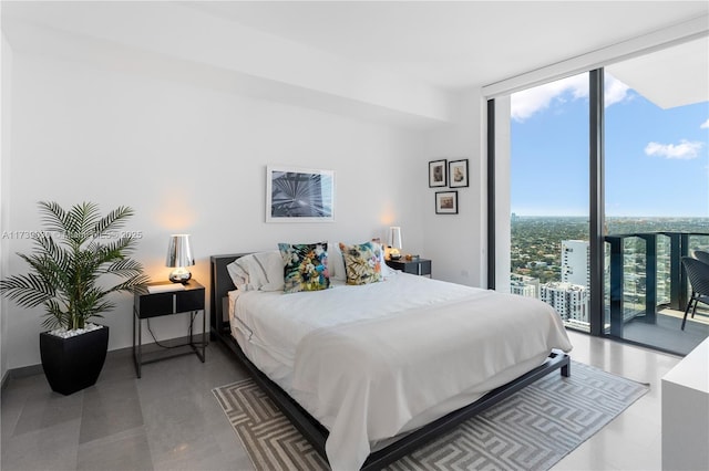 bedroom featuring access to outside and floor to ceiling windows