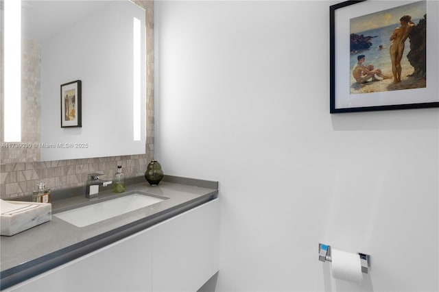 bathroom with vanity and backsplash