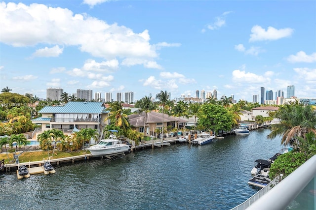 property view of water with a view of city and a dock